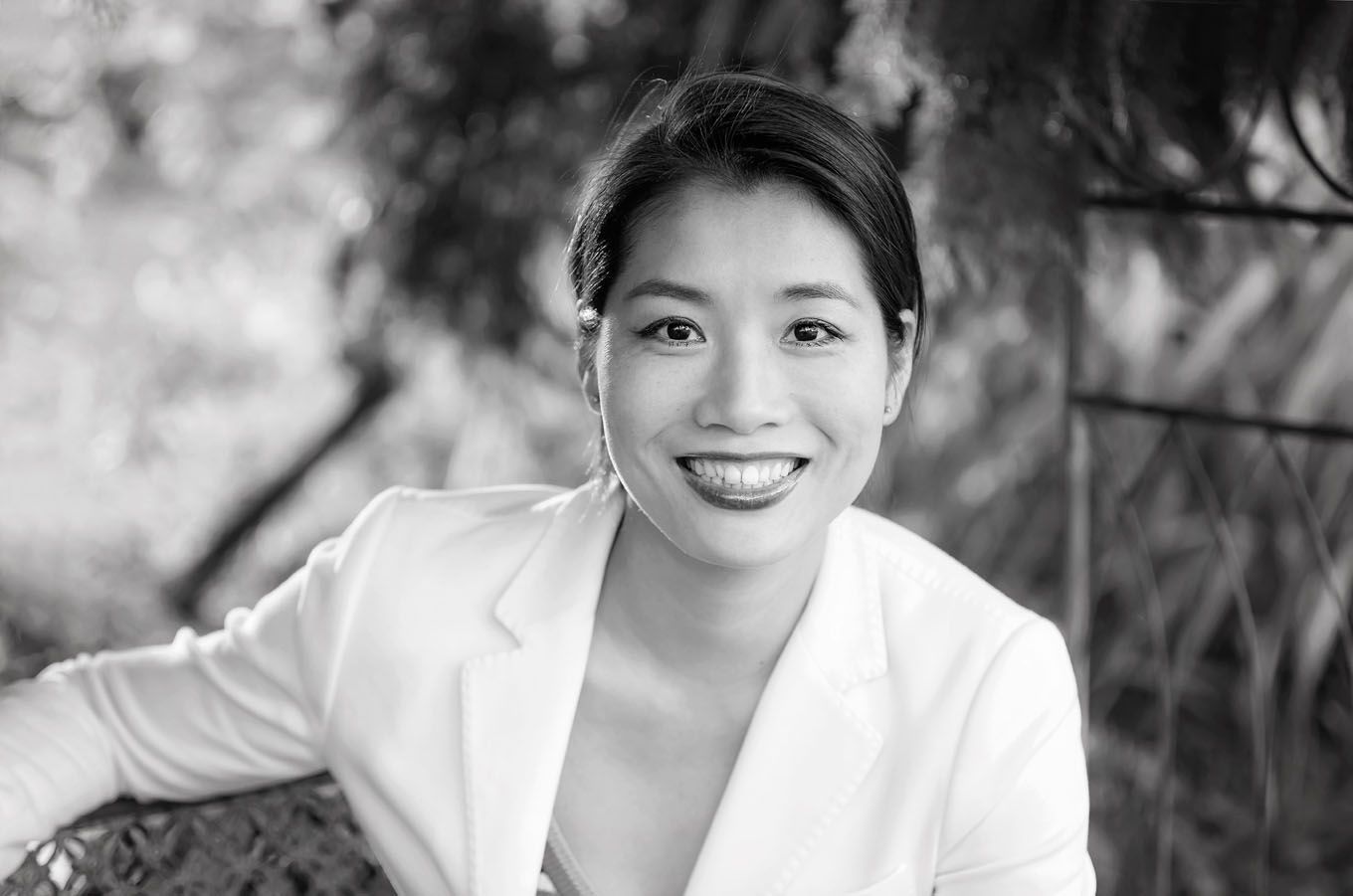 A portrait of a woman taken outdoors